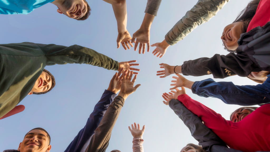 Community group putting hands together